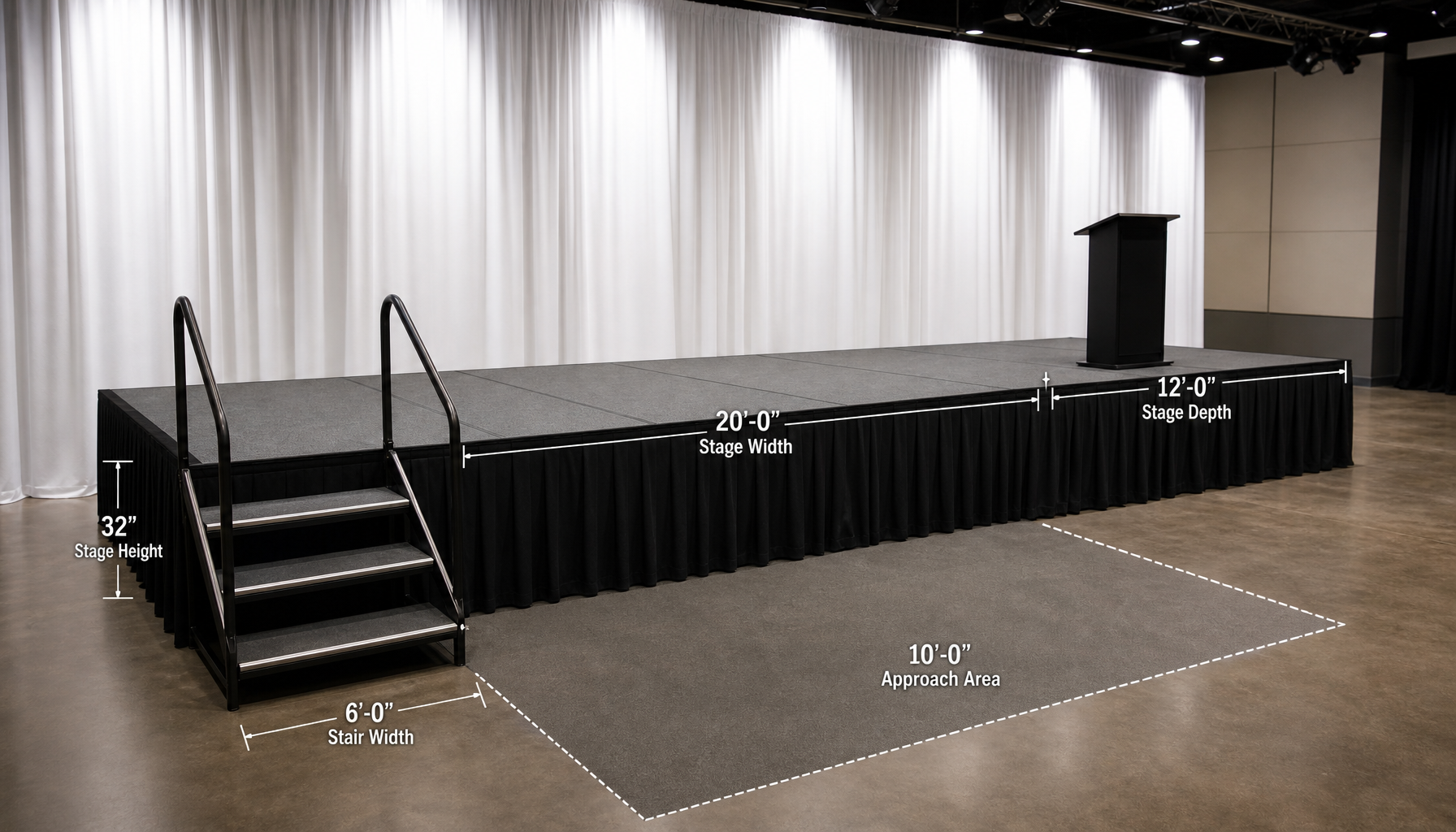 Black elevated stage platform with gray surface and stepped access set up in an indoor venue, with white vertical curtain backdrop and overhead lighting, showing platform dimensions and approach area