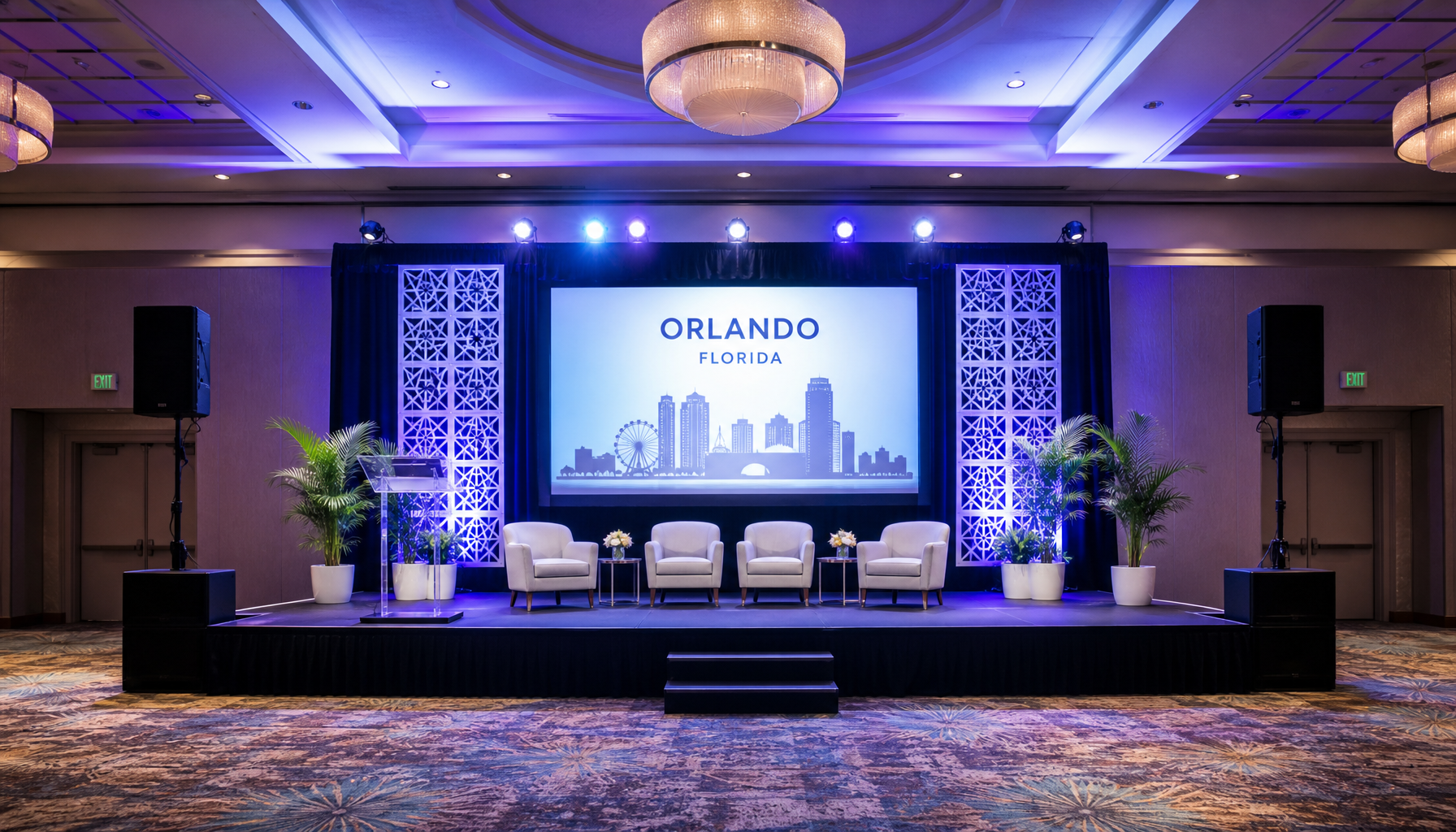 corporate event stage setup inside hotel ballroom with PA speakers on stands and stage lighting active, Orlando venue